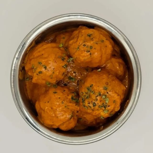 Chicken Momo Butter Masala.