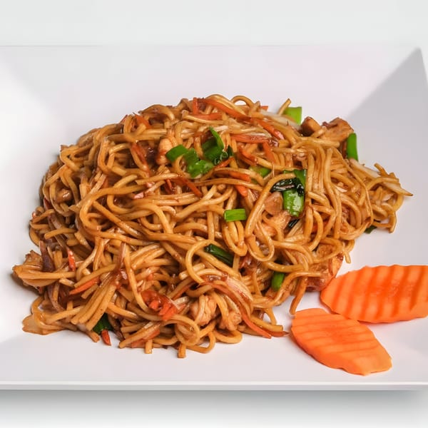 Himalaya on Heights' Nepalese chowmein noodles with vegetables and chicken, garnished with carrot slices.